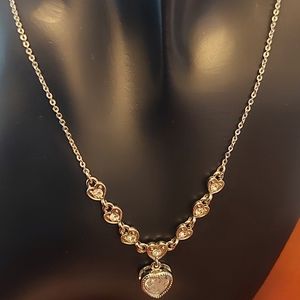 Silver tone necklace with heart pendant